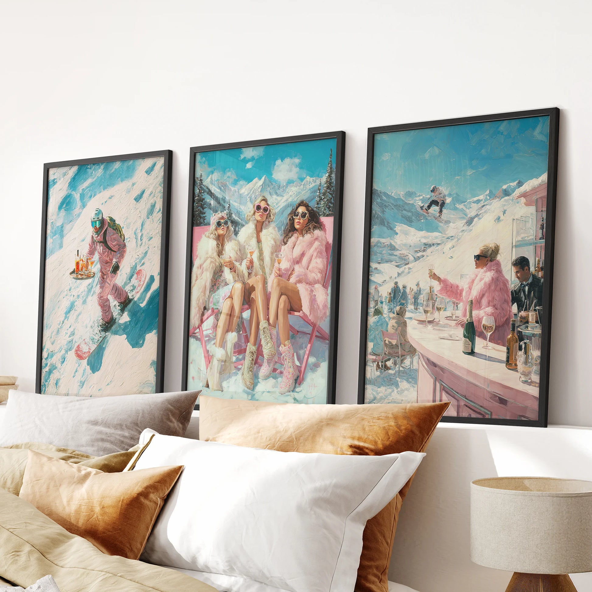 A stylish wall art 3 set featuring apres-ski scenes in sleek black frames, hung over the bed headboard to give the bedroom a cozy lodge tone.