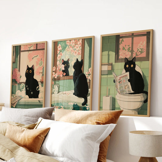 Quirky cat toilet poster, a three-poster wall set in light wood frames, adds a cheeky accent to the bedroom over the bed.