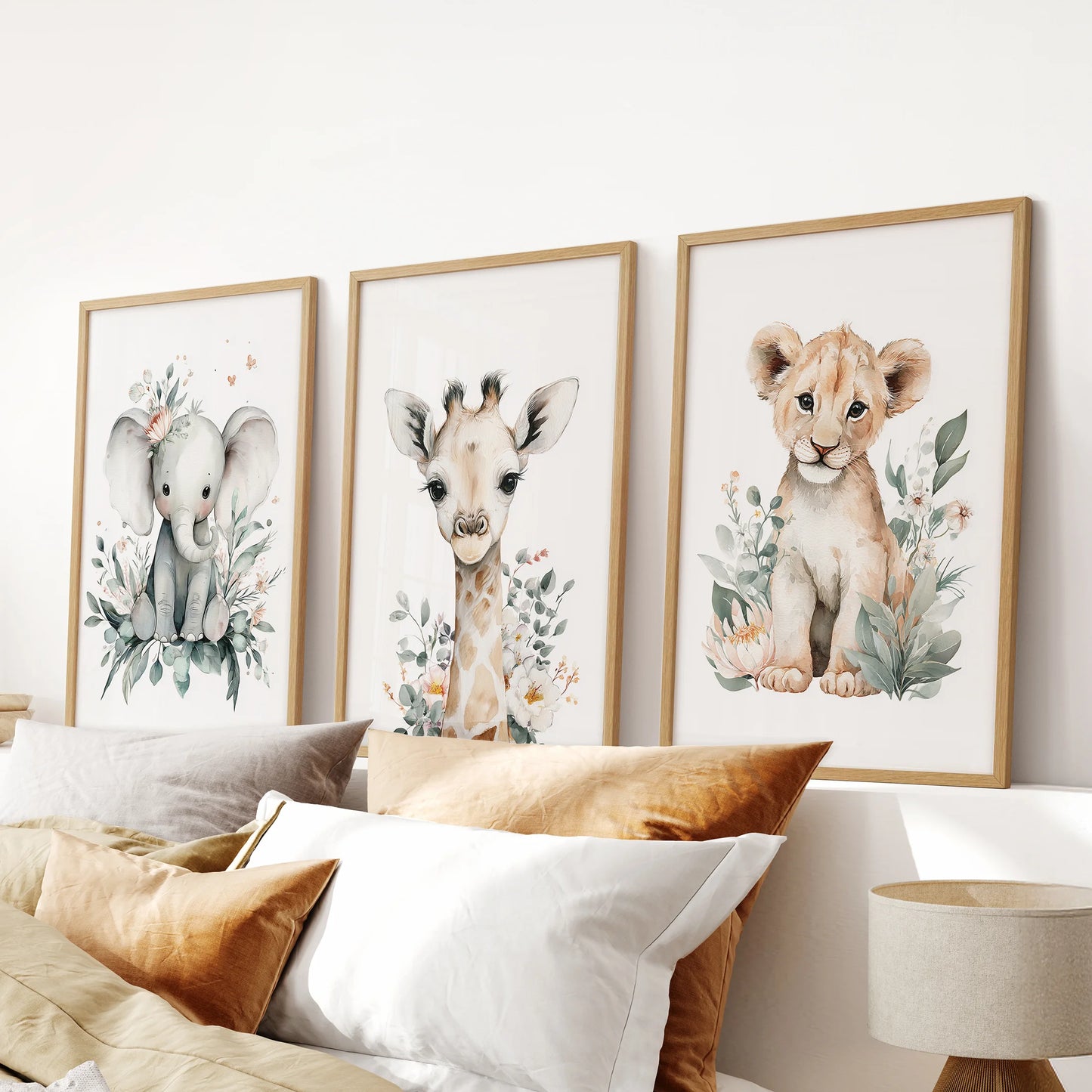 Baby animals wall print trio, a 3-piece set with natural oak frames, made for the bedroom and balanced above the headboard.