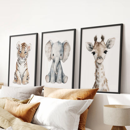 Friendly tiger, elephant and giraffe artwork set of three for a gender-neutral baby room. Black frames for bedroom.