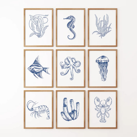 Set of 9 navy blue nautical prints with fish, octopus, lobster, and coral wall art. Thinwood frames for bathroom.