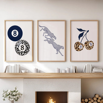 Leopard pattern artwork, a set of three framed prints in oak, grounds the sitting room display over the mantelpiece with bold texture.