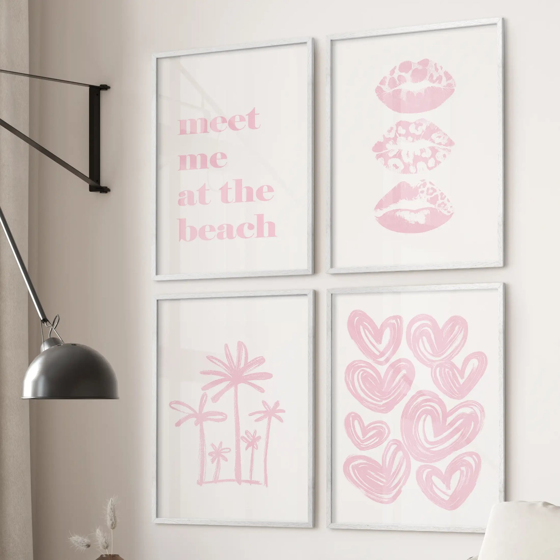Four white-framed prints of a coastal girl illustration line the wall over the sofa, adding a pale pink, beachy vibe to the lounge.