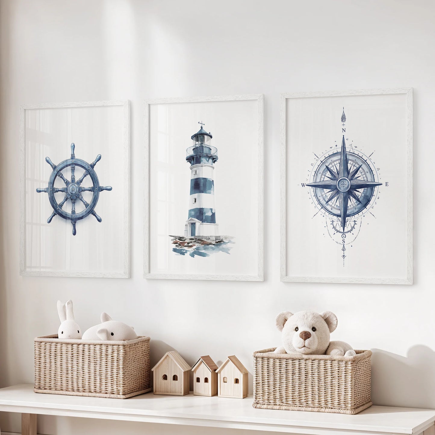 Three nautical wall art prints lighthouse and compass in white frames brighten the kids playroom over the toy storage bench.