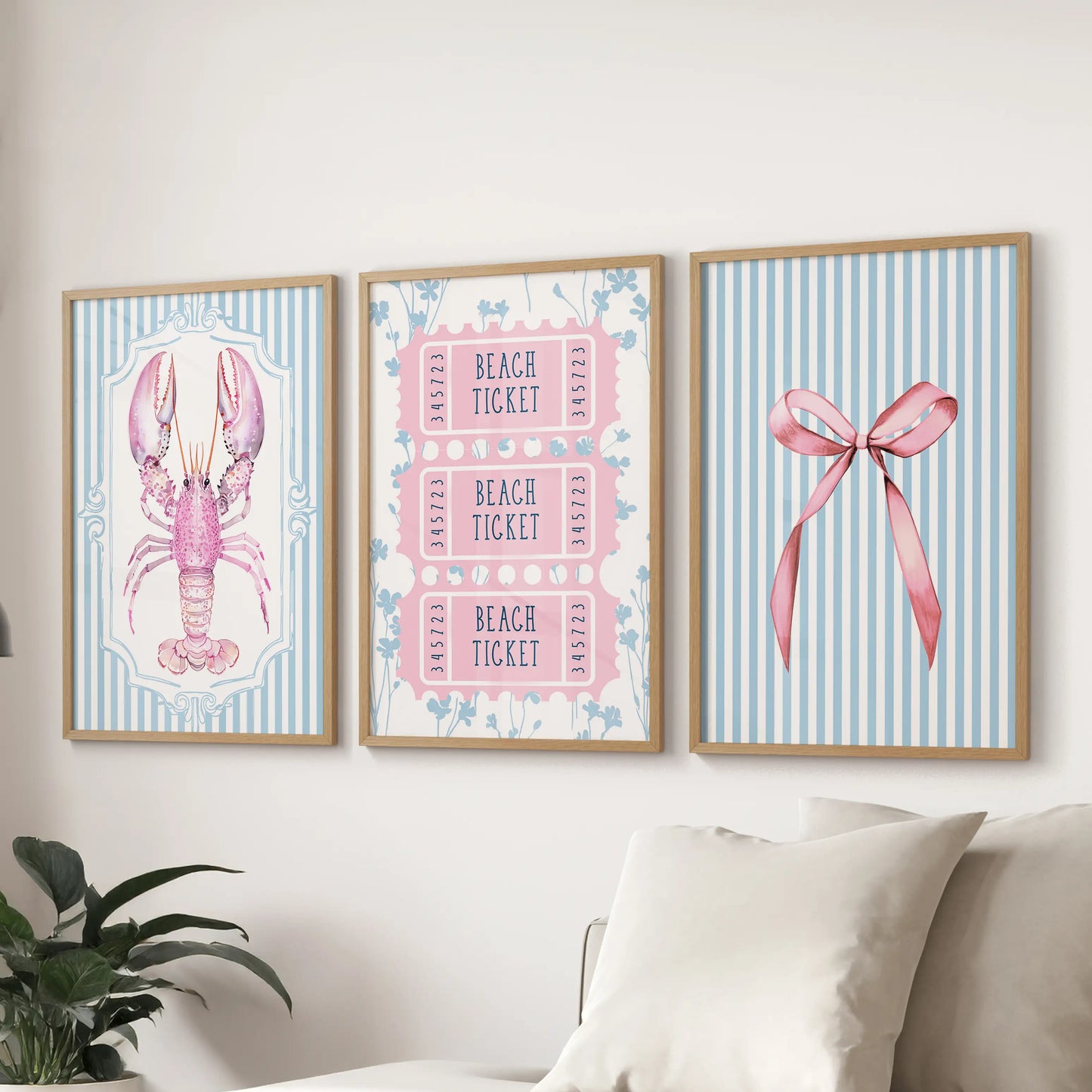 Seashell and starfish prints framed in natural oak form a harmonious three-piece set across the lounge wall above the sectional.