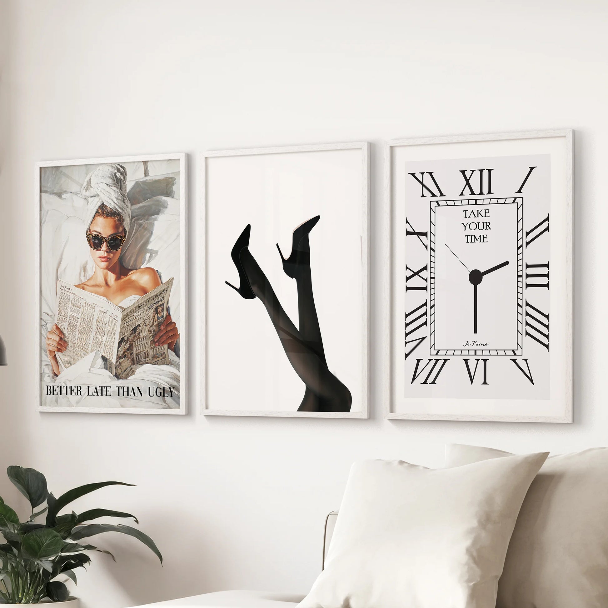 Fashion quote typography prints, a set of three in white frames, sit above the sectional to give the sitting room an editorial, minimalist feel.