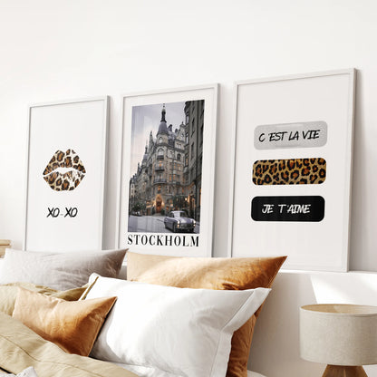Stockholm-style magazine posters in a three-print set lend clean, editorial flair to the bedroom over the headboard, framed in fresh white.