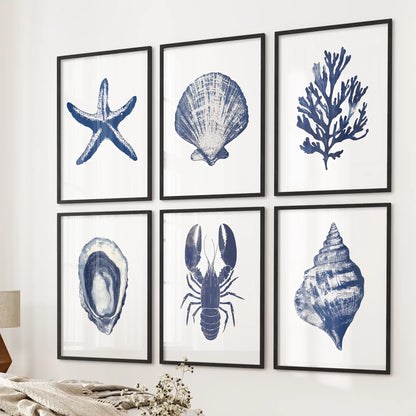 Neutral coastal large poster. Starfish ocean wall art beach house decoration. Black frames over the bed.