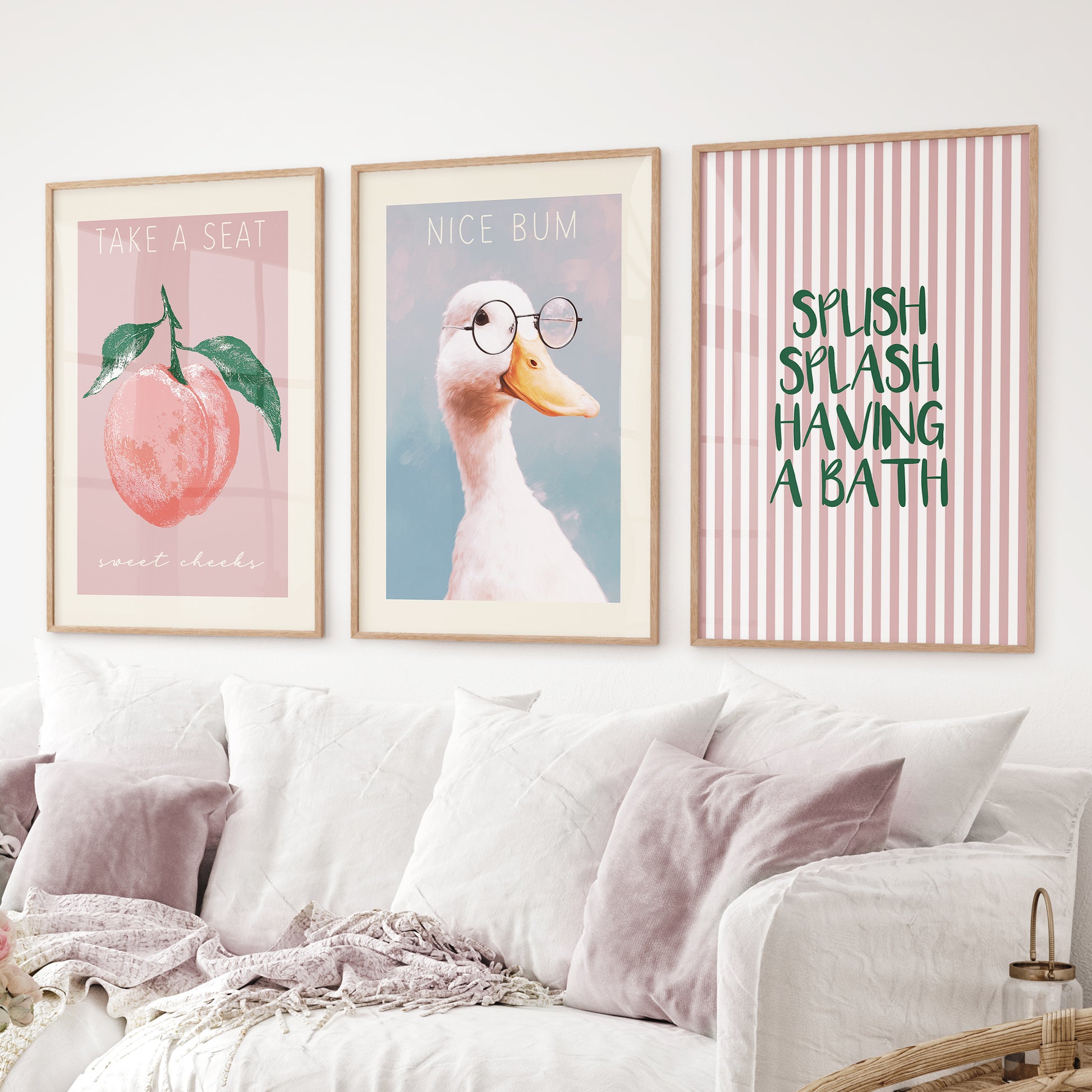 Humorous duck print with “Nice Bum” text for bathroom wall decor. Thinwood frames over the couch.