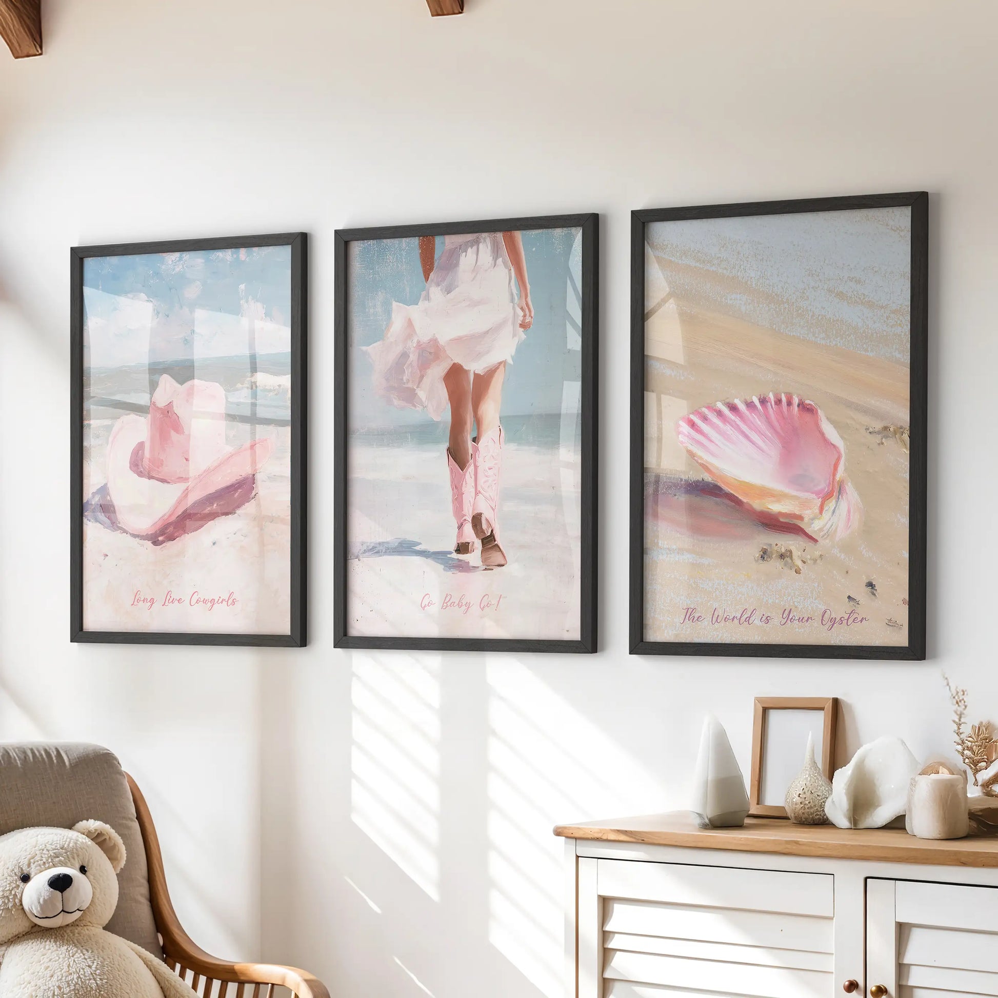 Pink seashells set of three wall art prints in sleek black frames, ideal for a kids room above the chest of drawers, adding breezy seaside color.