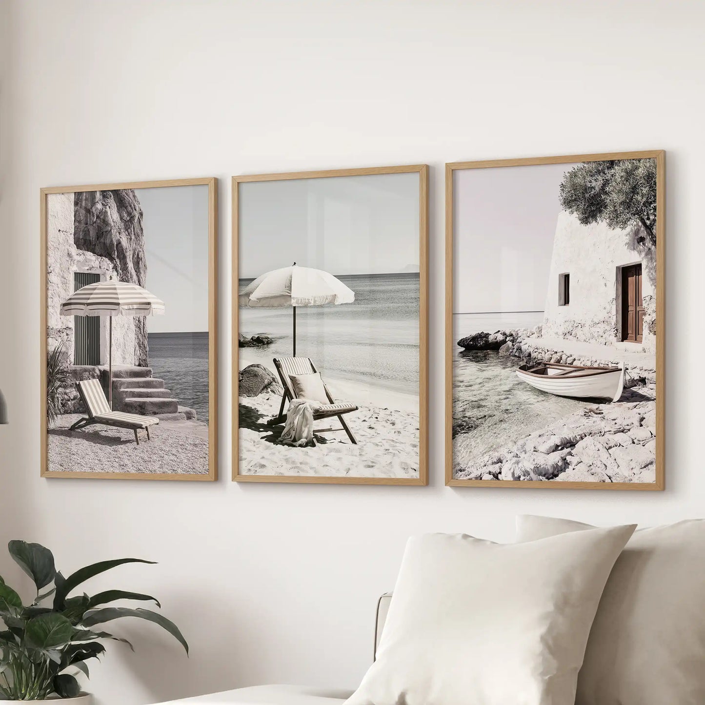 Wall art set of three displays calm ocean and shoreline scenes in oak frames. Floated above the sectional, it brings relaxed Mediterranean character to the sitting room.