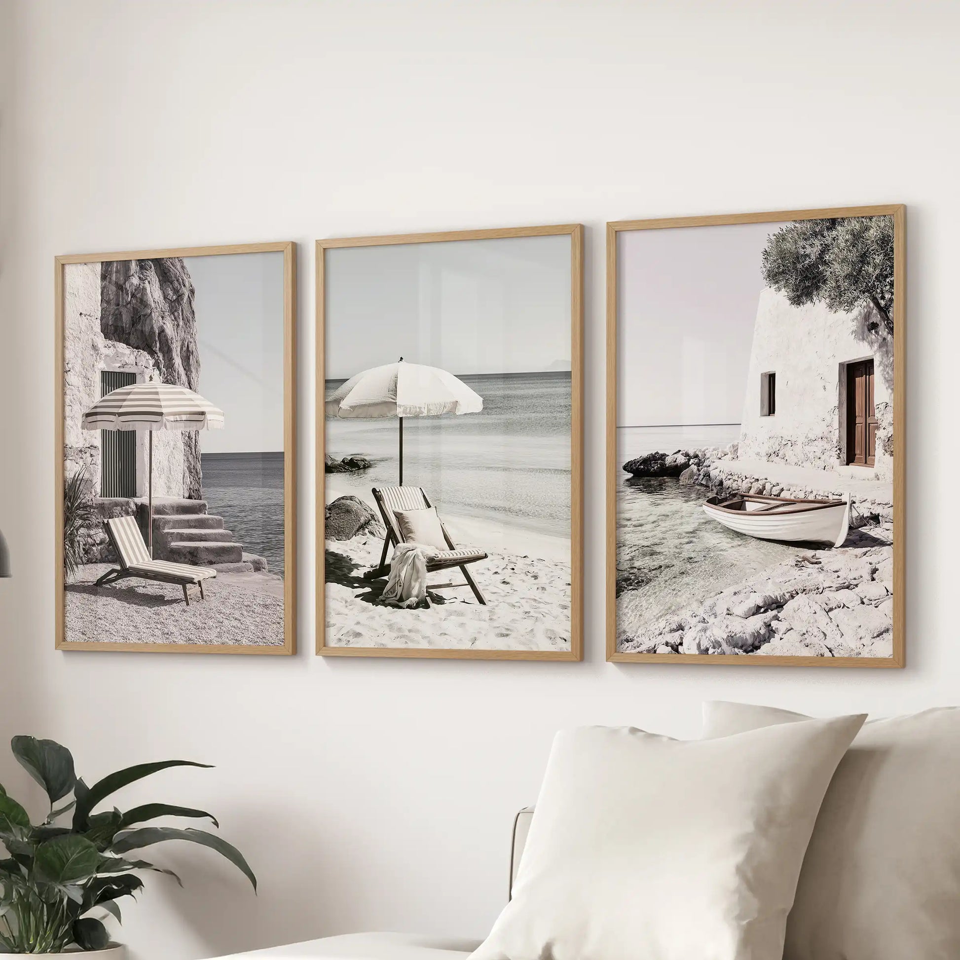 Wall art set of three displays calm ocean and shoreline scenes in oak frames. Floated above the sectional, it brings relaxed Mediterranean character to the sitting room.