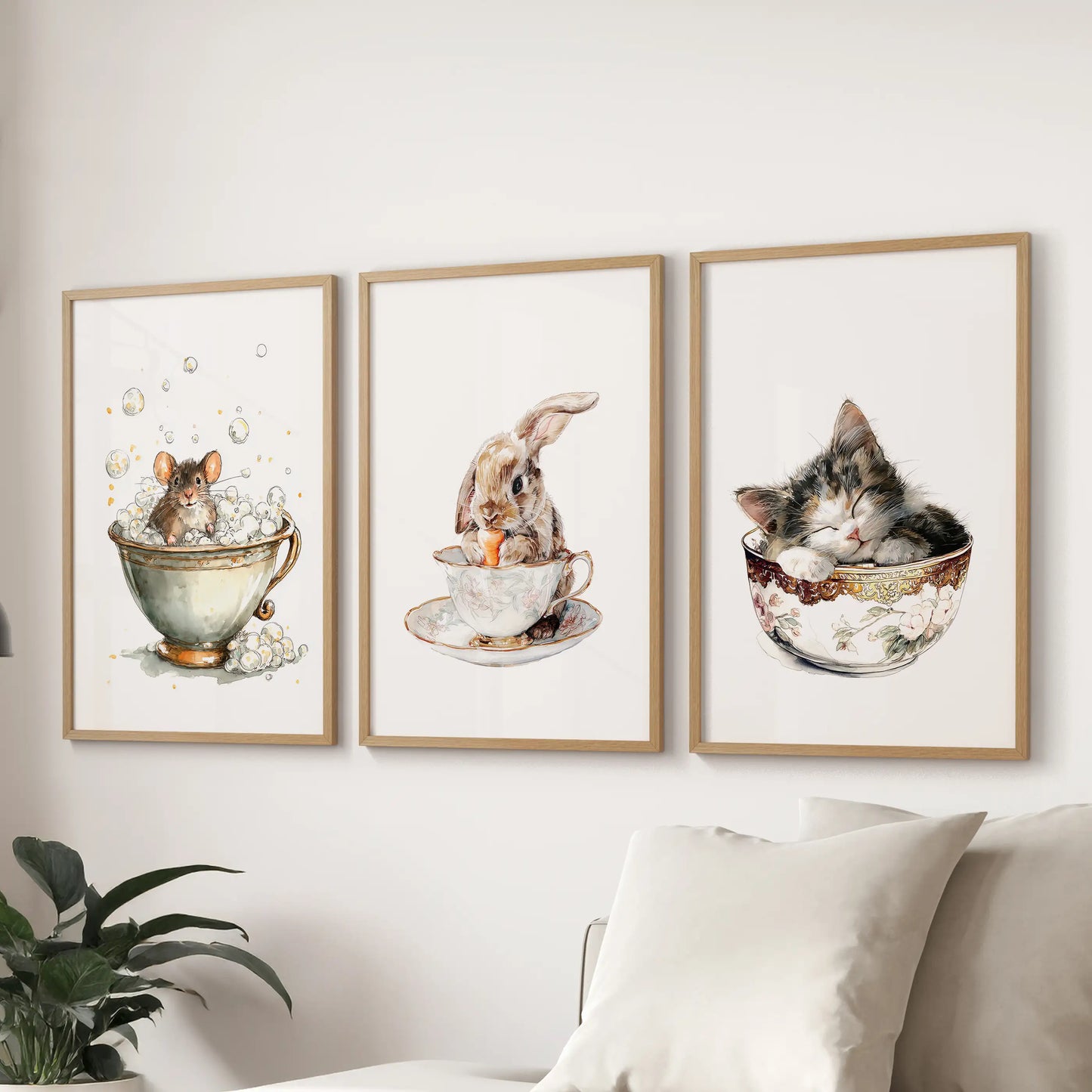 Above the family room couch, a light-wood-framed 3-print wall art set of a bunny in a teacup forms a quaint cottage nook.