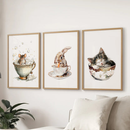 Above the family room couch, a light-wood-framed 3-print wall art set of a bunny in a teacup forms a quaint cottage nook.