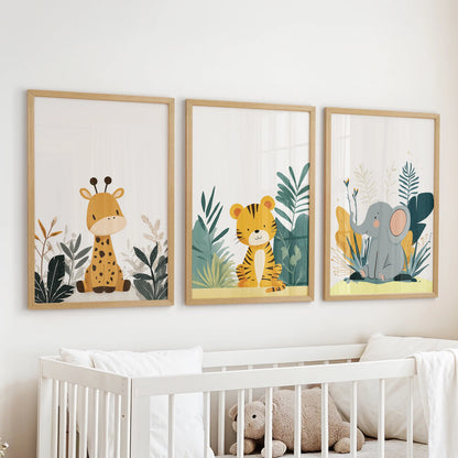 Minimalist animal wall trio in natural wood framed prints softens the infant room, positioned neatly above the cot.