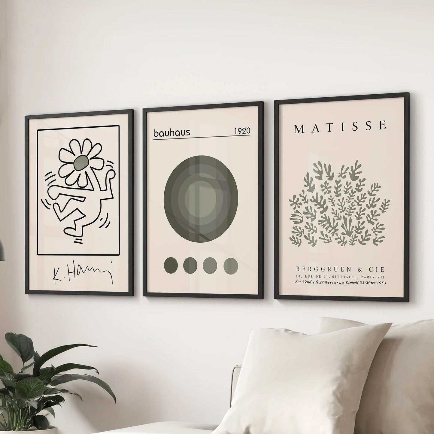 Matisse-inspired cutout prints in a trio, wall art for the sitting room, hung behind the couch in sleek black frames to bring soft green tones.