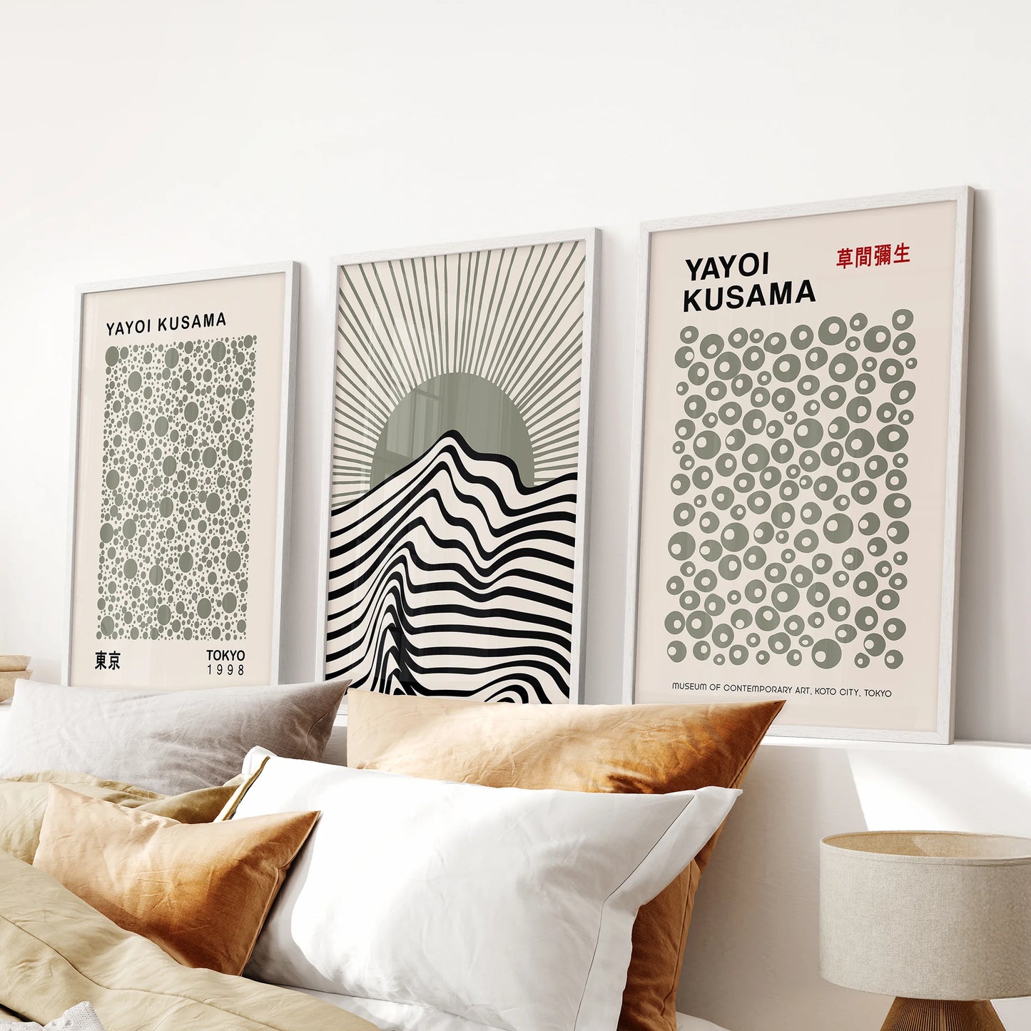 Neutral green, black, and beige minimal abstracts, a three-print wall art set mounted above the bed in white frames for a soft, contemporary statement.
