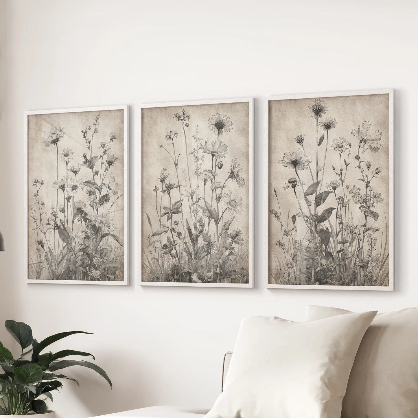 Wildflower drawings, a 3-piece wall art set with clean white frames, anchor the lounge behind the couch for a light, modern touch.