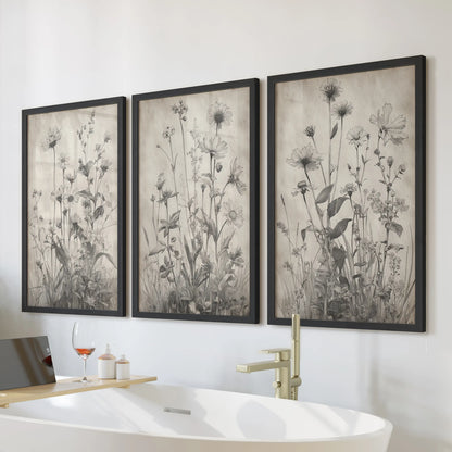 This trio of black-framed botanical wall prints brings a modern farmhouse feel to the bathroom wall above the tub.