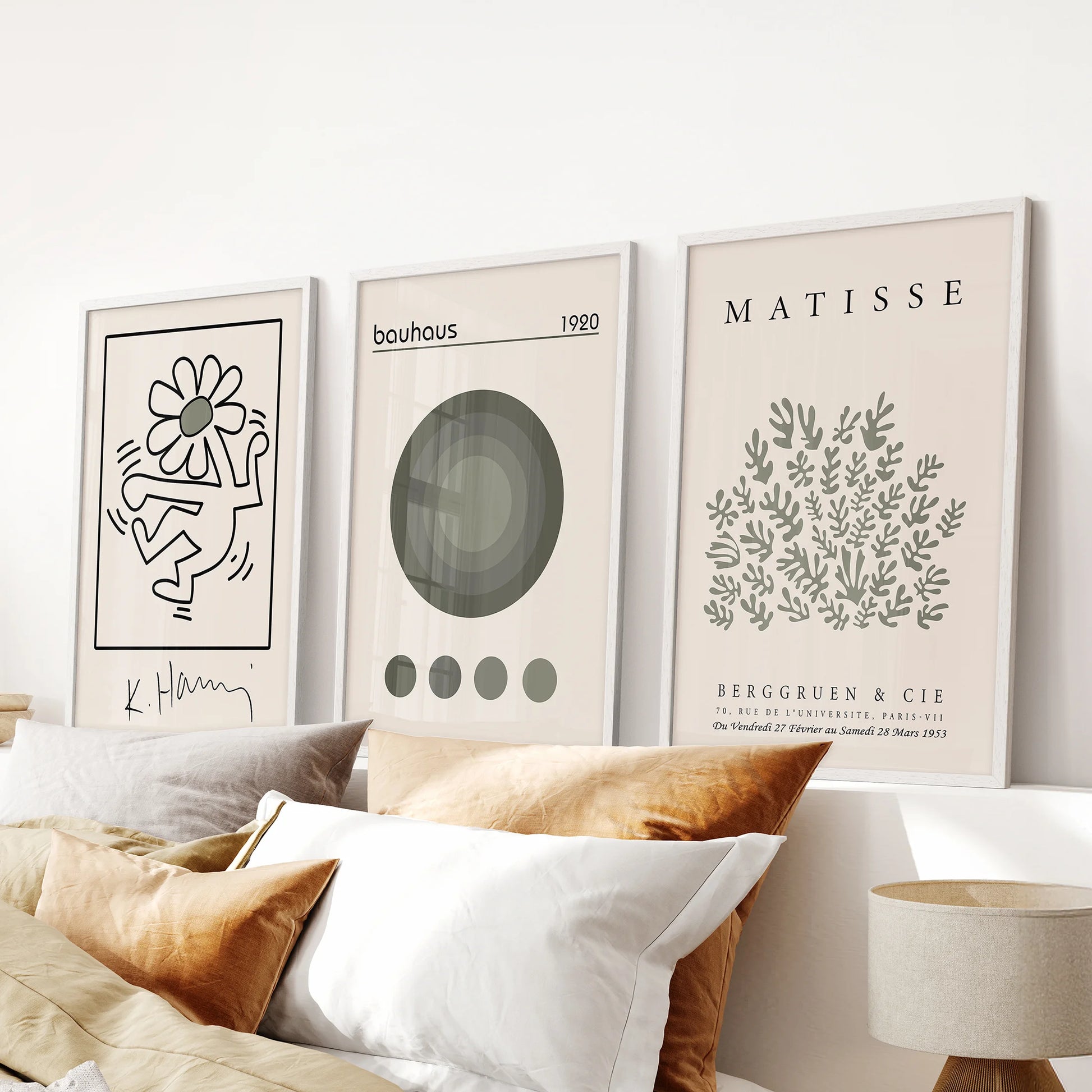 Bauhaus geometric art prints, three-print set, white frames and arranged above the headboard to freshen the bedroom with airy sage and neutrals.