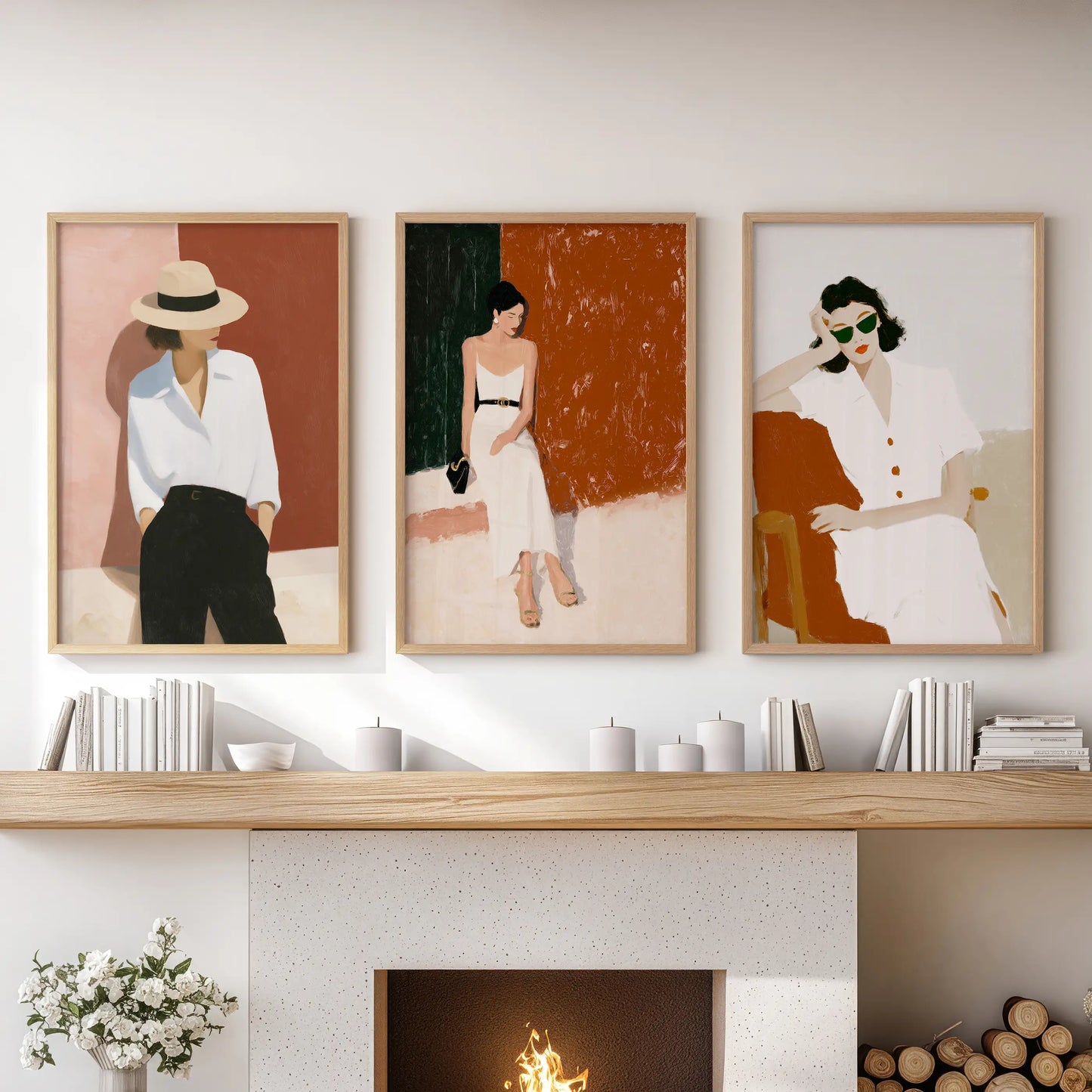Elegant women portraits, a set of three prints, rest over the hearth in the family room, softly grounded by light oak frames.