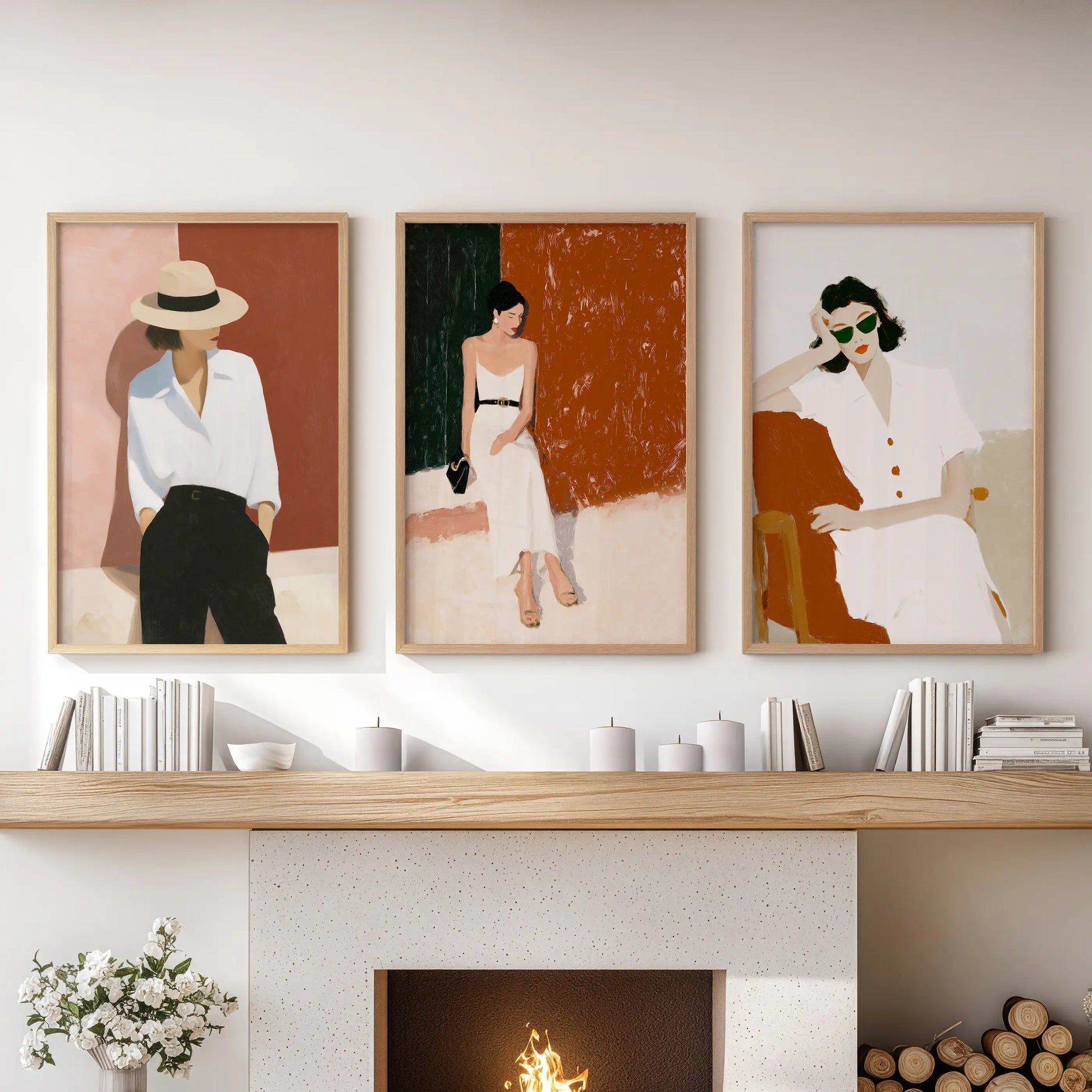 Elegant women portraits, a set of three prints, rest over the hearth in the family room, softly grounded by light oak frames.