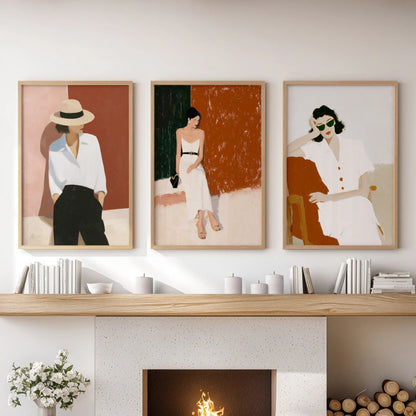 Elegant women portraits, a set of three prints, rest over the hearth in the family room, softly grounded by light oak frames.