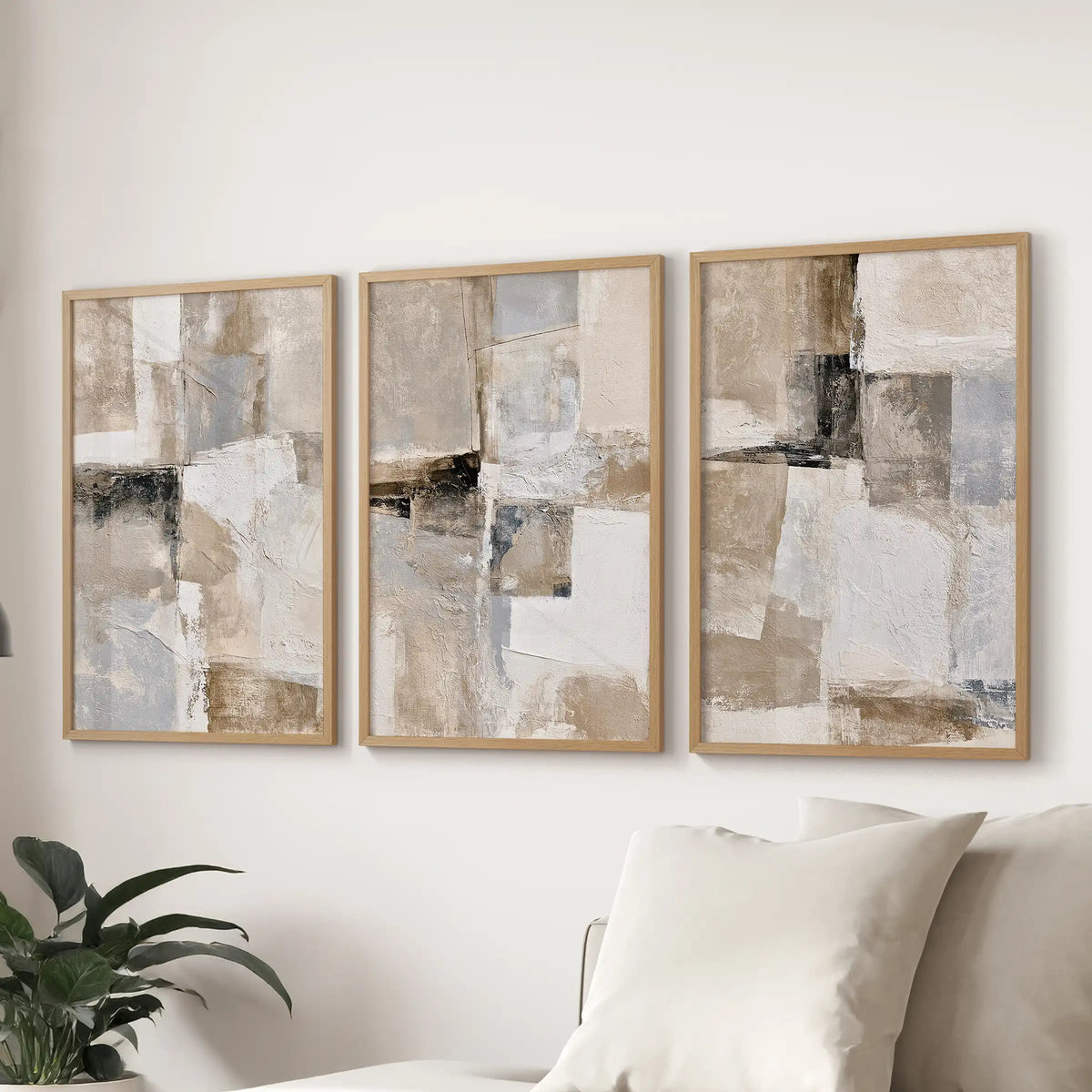 Beige brushstrokes, a 3-print wall art set, ties the lounge together over the couch with warm natural wood frames and calm, minimalist texture.