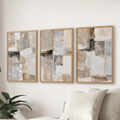 Beige brushstrokes, a 3-print wall art set, ties the lounge together over the couch with warm natural wood frames and calm, minimalist texture.