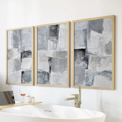 Monochrome minimalist abstracts poster set of 3, in thin wood frames, hangs above the soaking tub to bring warmth to the clean, modern bath.