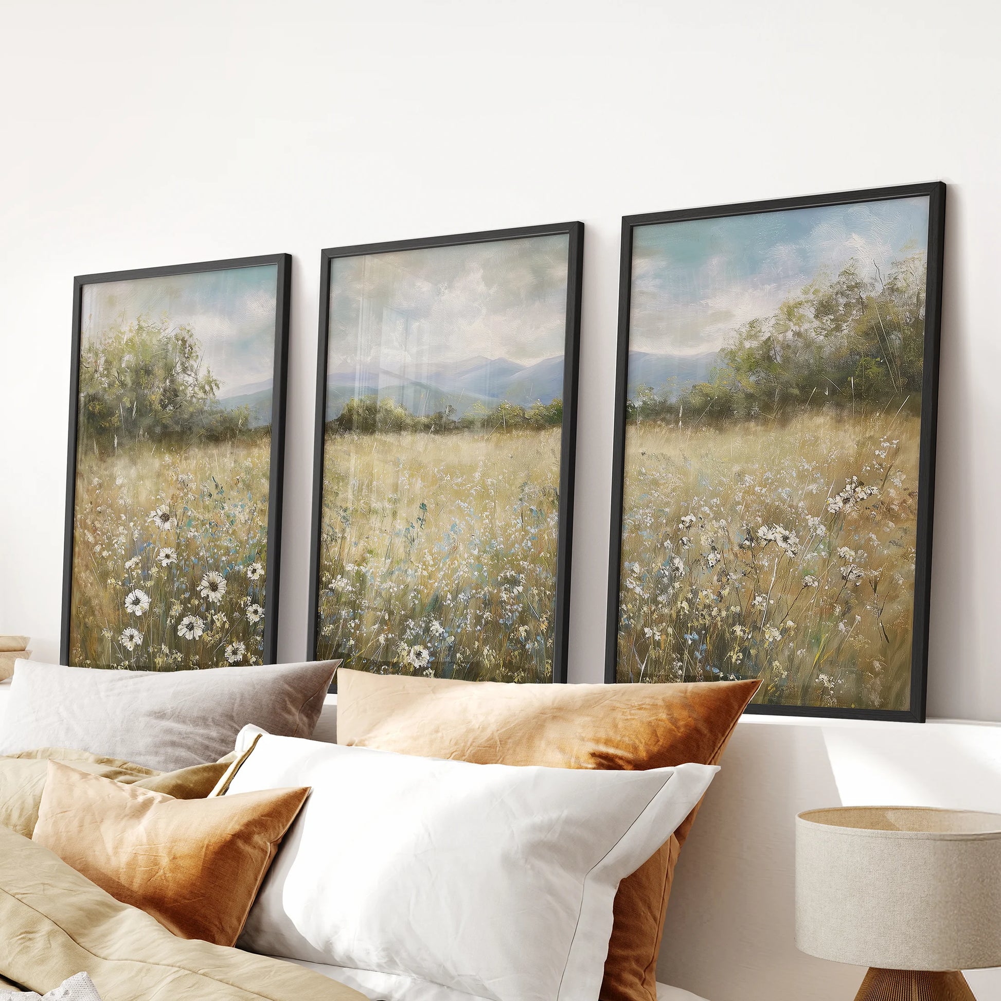 Wildflower field landscape three-piece wall art set in black frames, sized for the bedroom and designed to hang above the bed headboard.