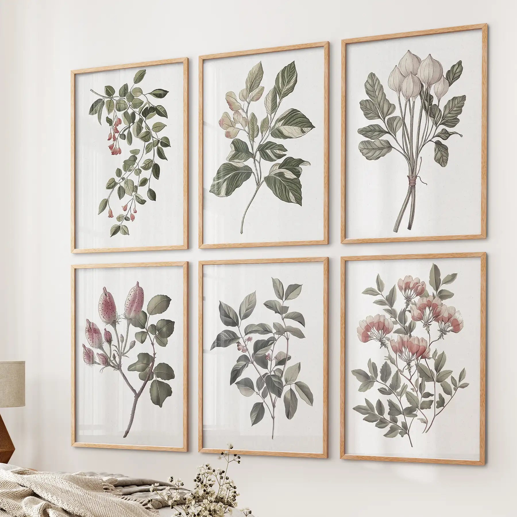 Farmhouse kitchen vintage wall art. Trendy cotton flower watercolor posters. Thinwood frames over the bed.