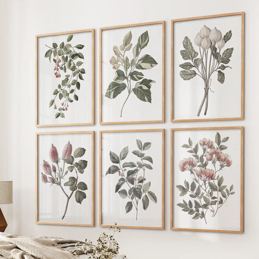 Farmhouse kitchen vintage wall art. Trendy cotton flower watercolor posters. Thinwood frames over the bed.