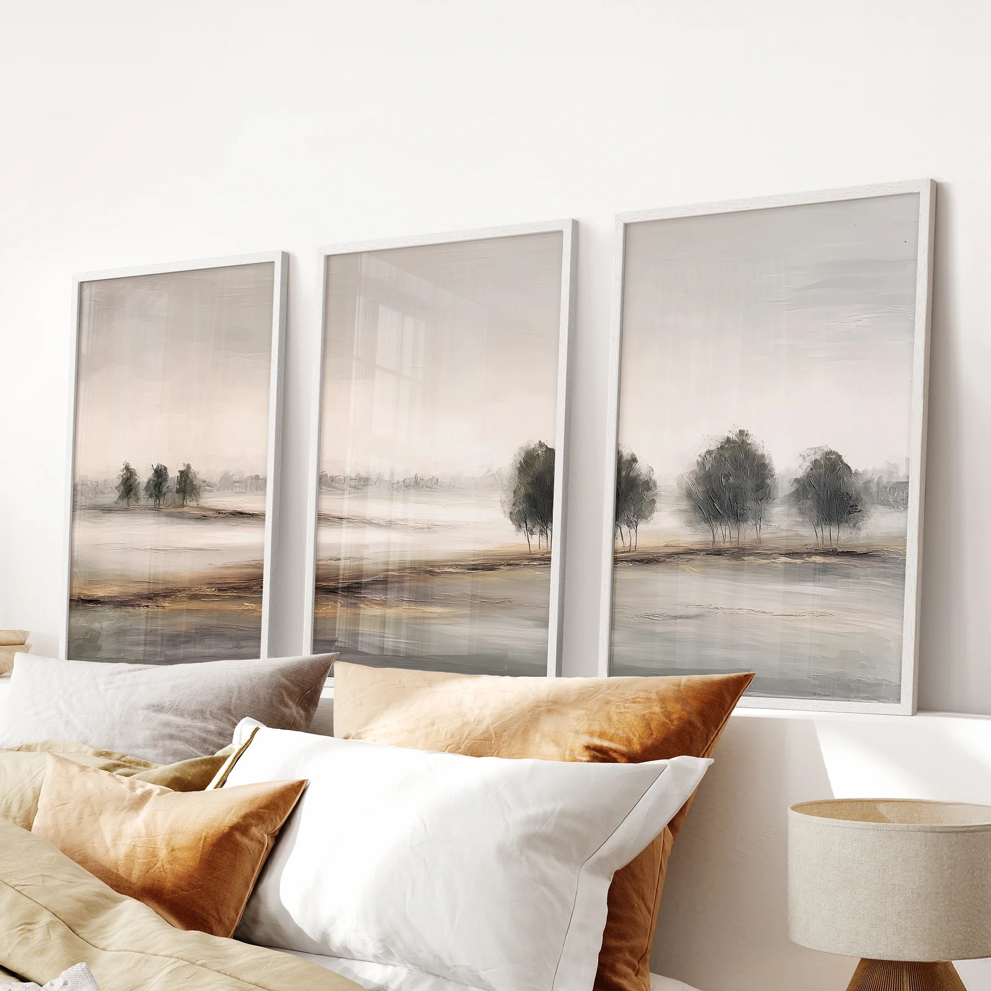 Wabi Sabi landscape art, a three-piece wall decor set in white frames, rests over the headboard to lend the bedroom an airy, minimalist mood.