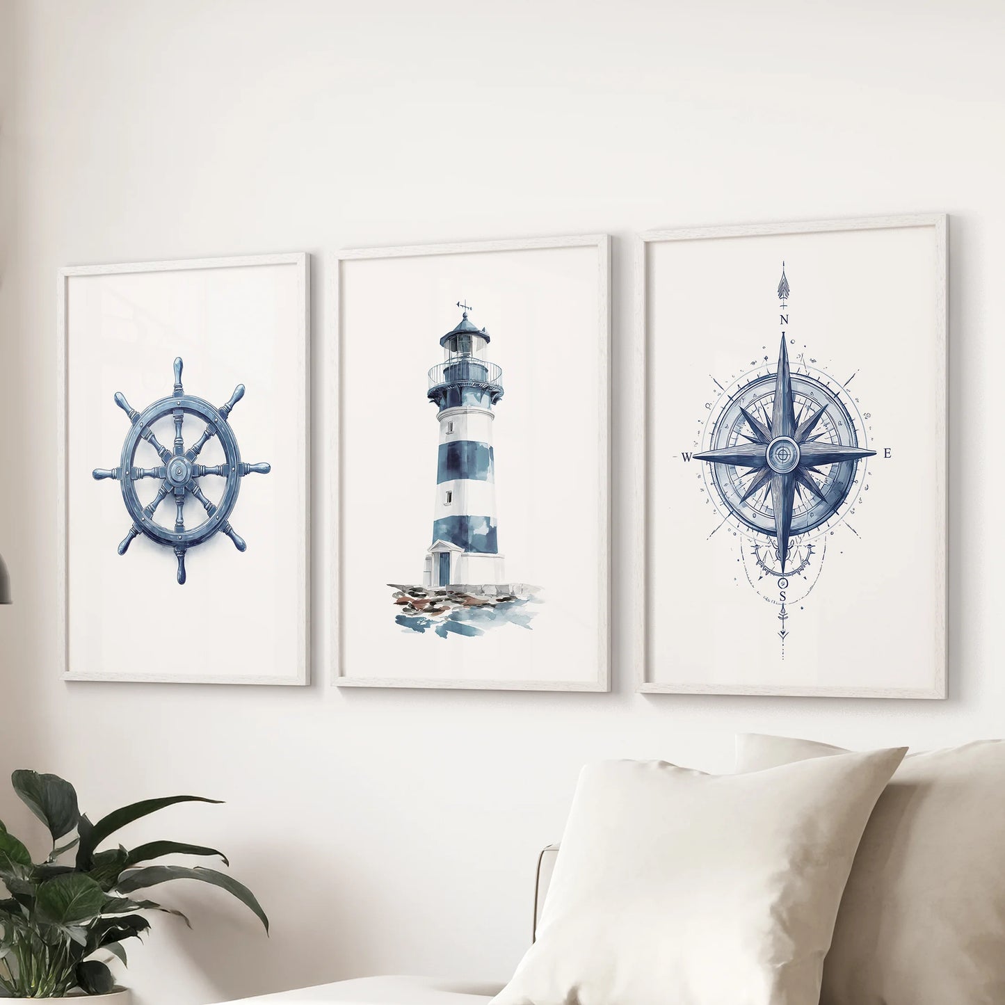 Compass three-print set, white framed, guides the family room and lines up over the sectional for crisp nautical wall decor in soft blue tones.