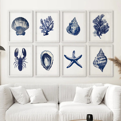 Trendy nautical watercolor paintings. Blue coastal sea animal wall art prints. White frames above the sofa.