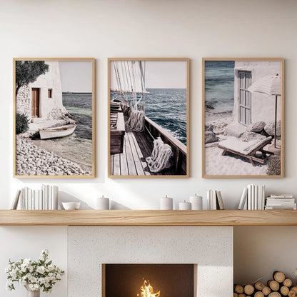 Greek island seascapes 3-piece wall art with light wood frames, set over the mantle to soften the sitting room with sunwashed nautical clarity.