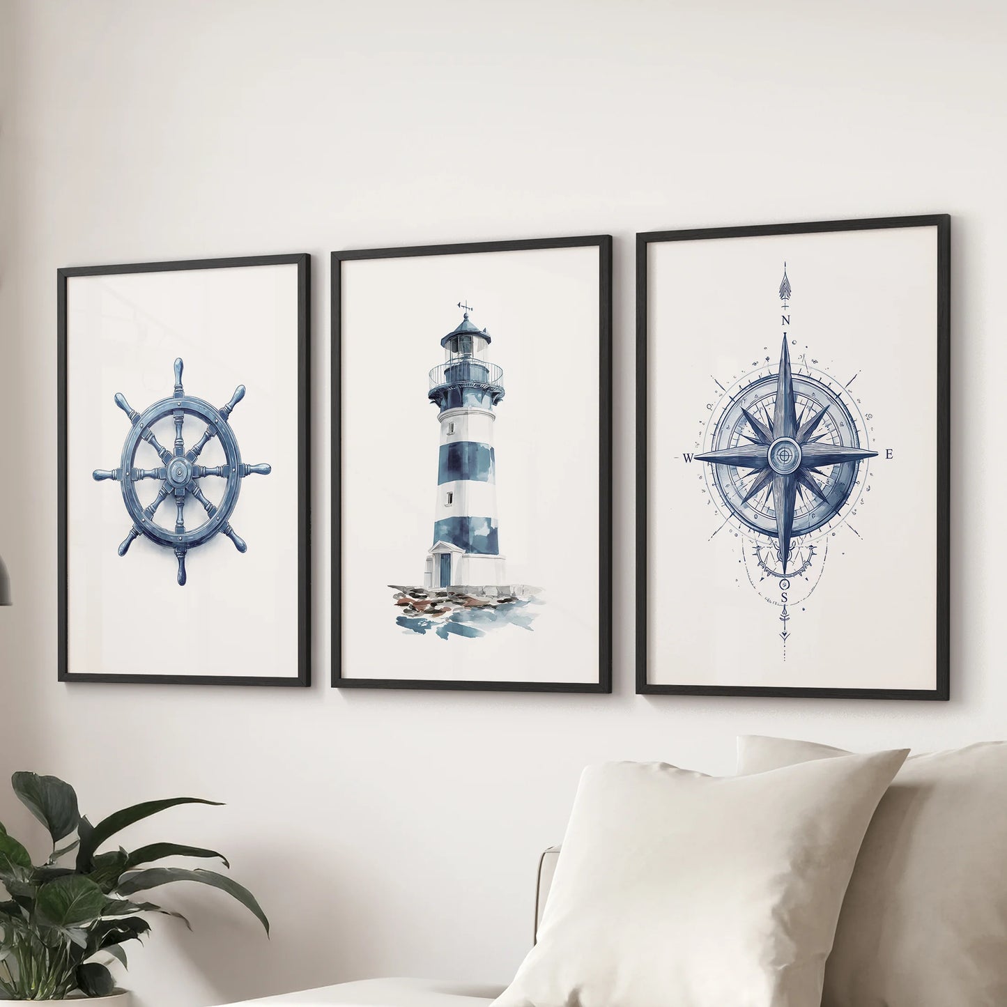 Ocean themed large set of three wall art prints in black frames sets a coastal mood in the living room, stretching behind the couch in deep navy hues.