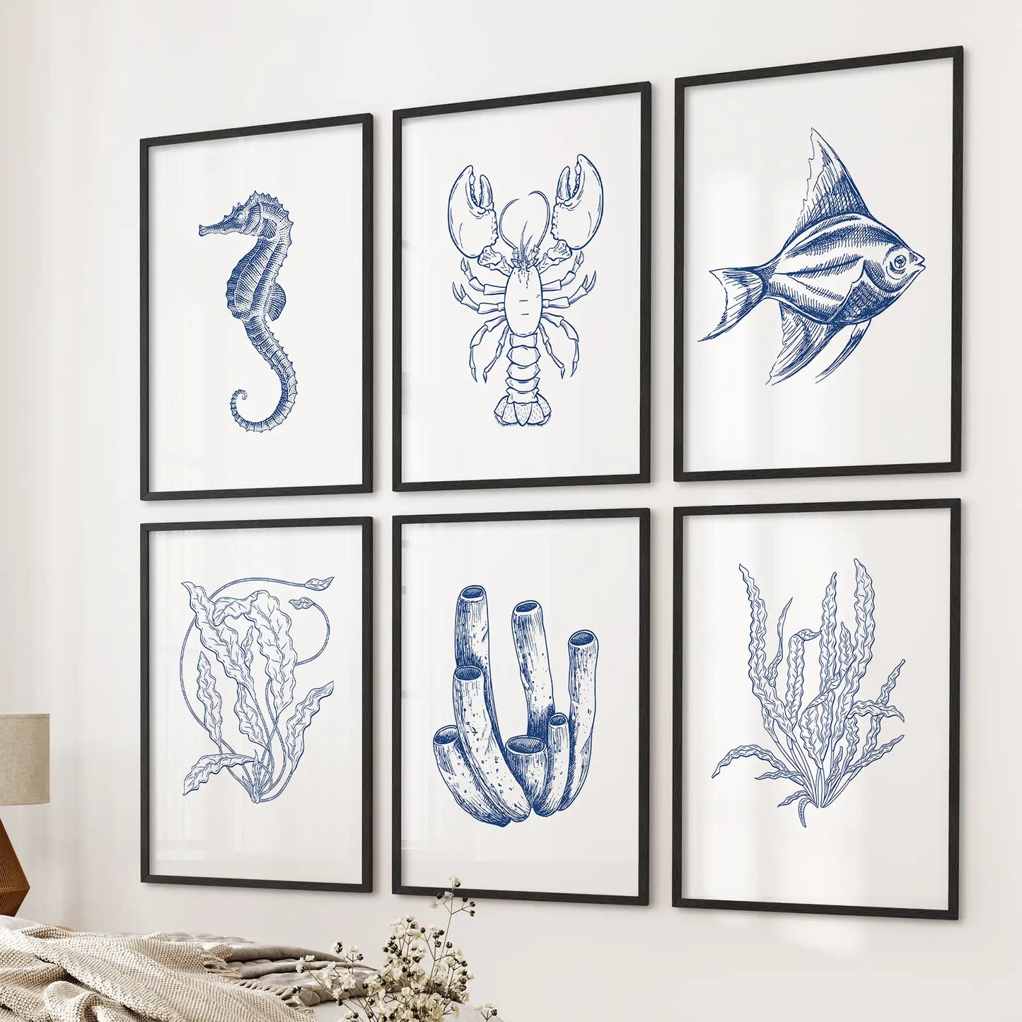 Marine animals drawing. Sea life art prints gallery set of 6 piece. Black frames above the bed.