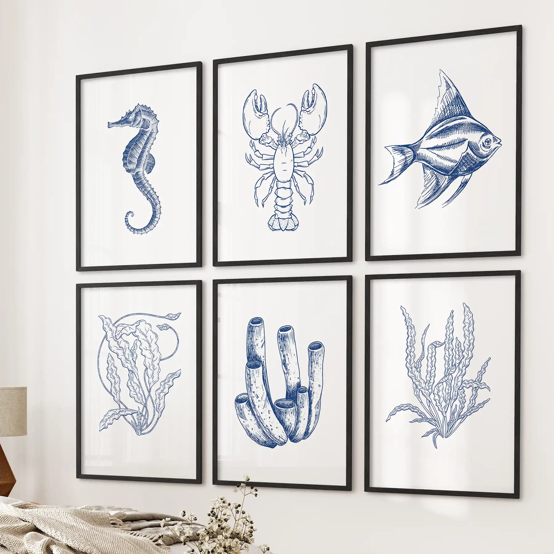 Marine animals drawing. Sea life art prints gallery set of 6 piece. Black frames above the bed.