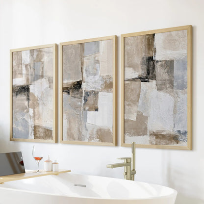 Japandi neutral triptych, a 3-piece poster set, warms the bathroom’s tub wall in natural wood frames for an airy, spa-like look.