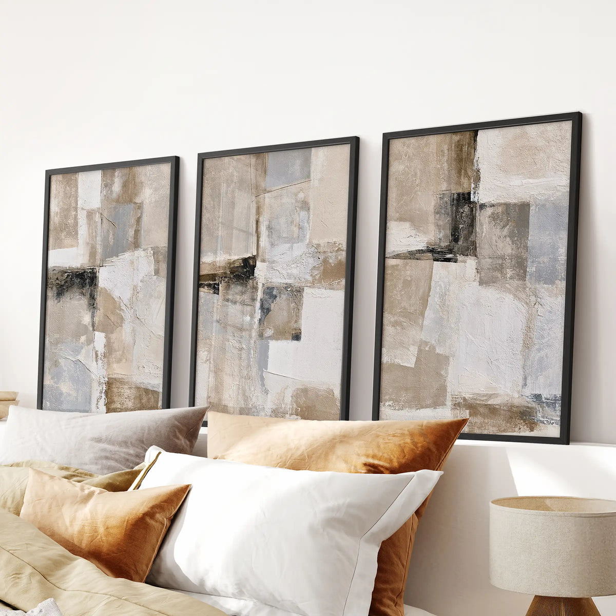 Geometric line forms, a trio of poster prints, centers the bedroom over the headboard in bold black frames for a clean, modern wall display.