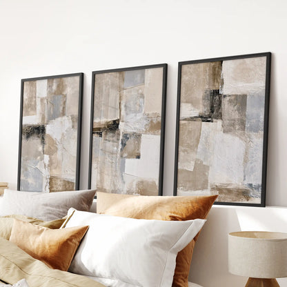 Geometric line forms, a trio of poster prints, centers the bedroom over the headboard in bold black frames for a clean, modern wall display.