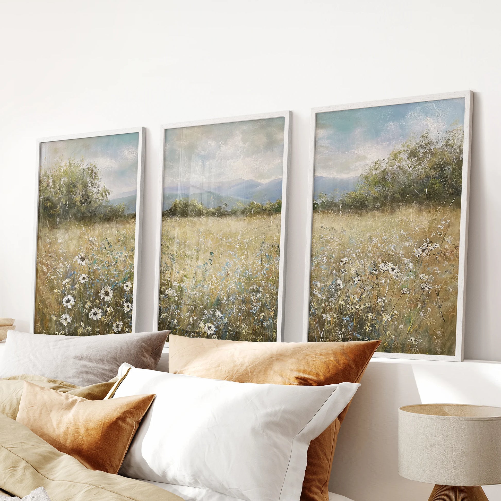 Soft country hills fill this 3-print wall art set in clean white frames, calming accent for a bedroom wall above the headboard.