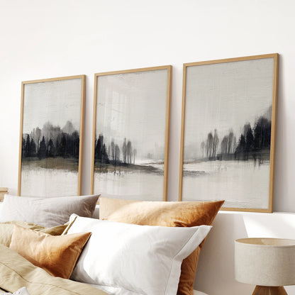 Modern wilderness landscape, a gallery set of three wall prints in warm oak frames, finishes the bedroom scene over the headboard.