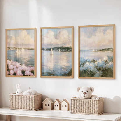 Cape Cod shoreline wall art 3 piece set centers the playroom above the toy organizer, light oak frames keeping the coastal path and sea grass tidy.