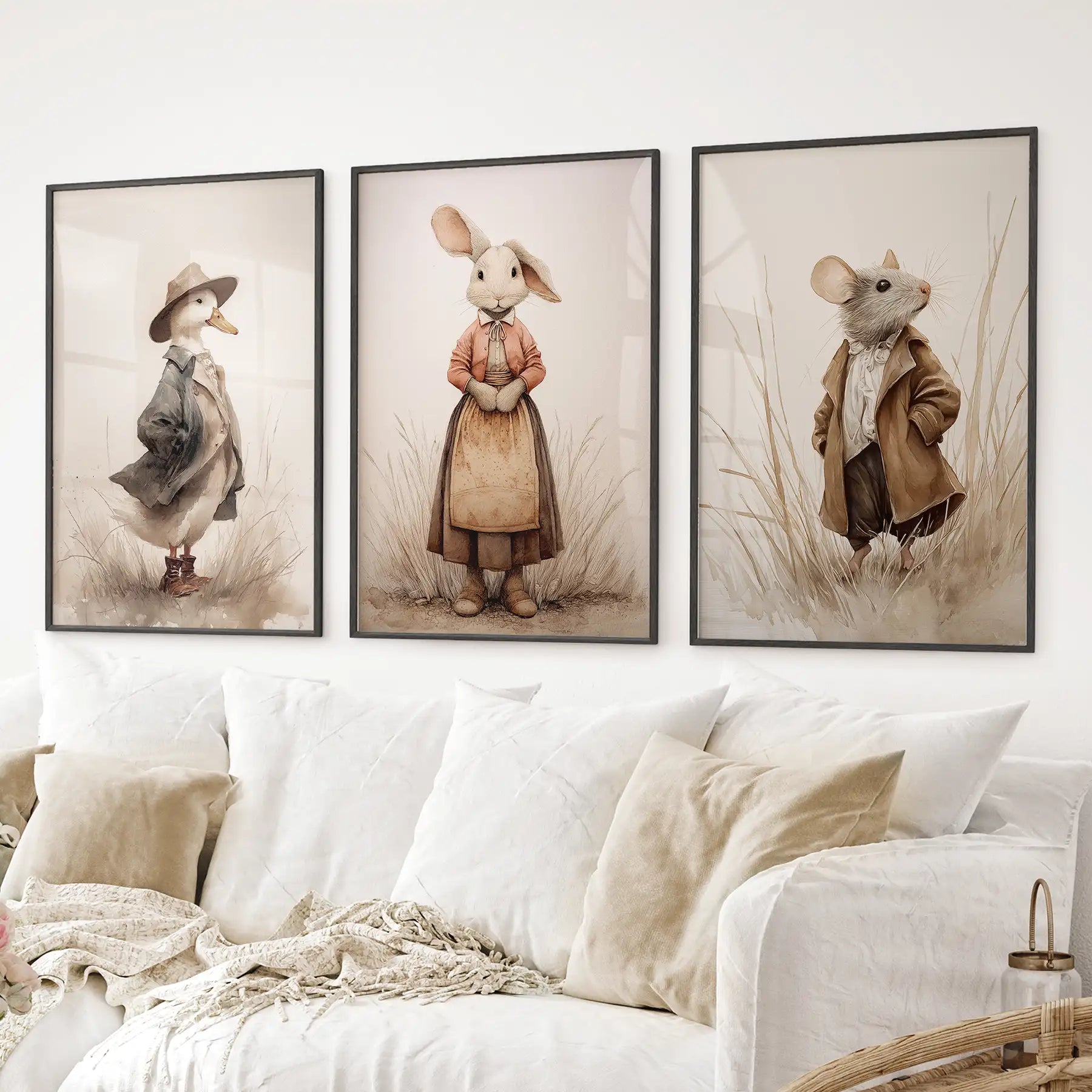 Cute mouse rabbit duck prints neutral beige cottagecore posters. Black frames above the sofa.