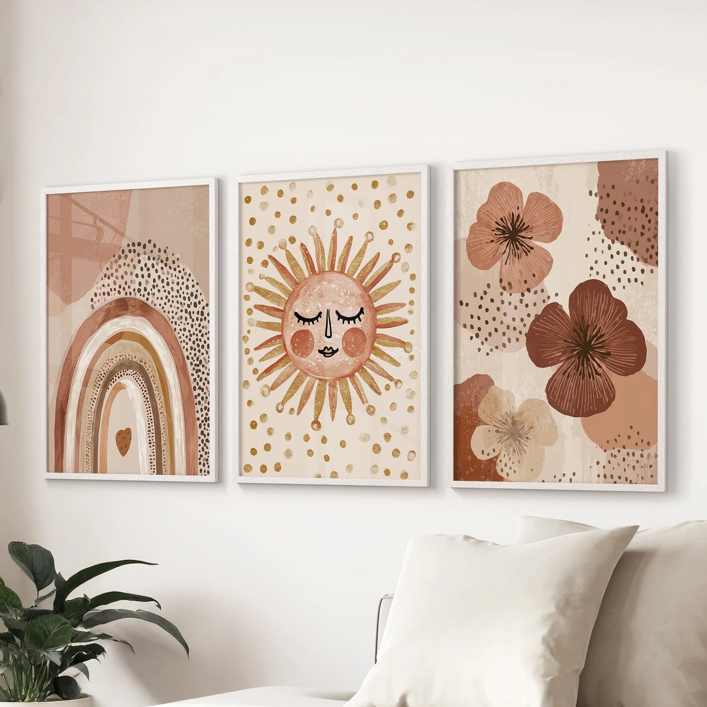 A playful sun and rainbow poster trio, framed in crisp white, arcs color across the living room wall above the couch for an easy, joyful look.