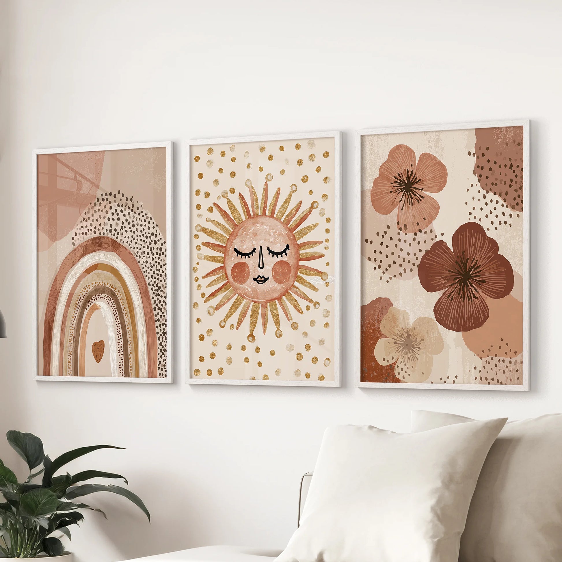 A playful sun and rainbow poster trio, framed in crisp white, arcs color across the living room wall above the couch for an easy, joyful look.