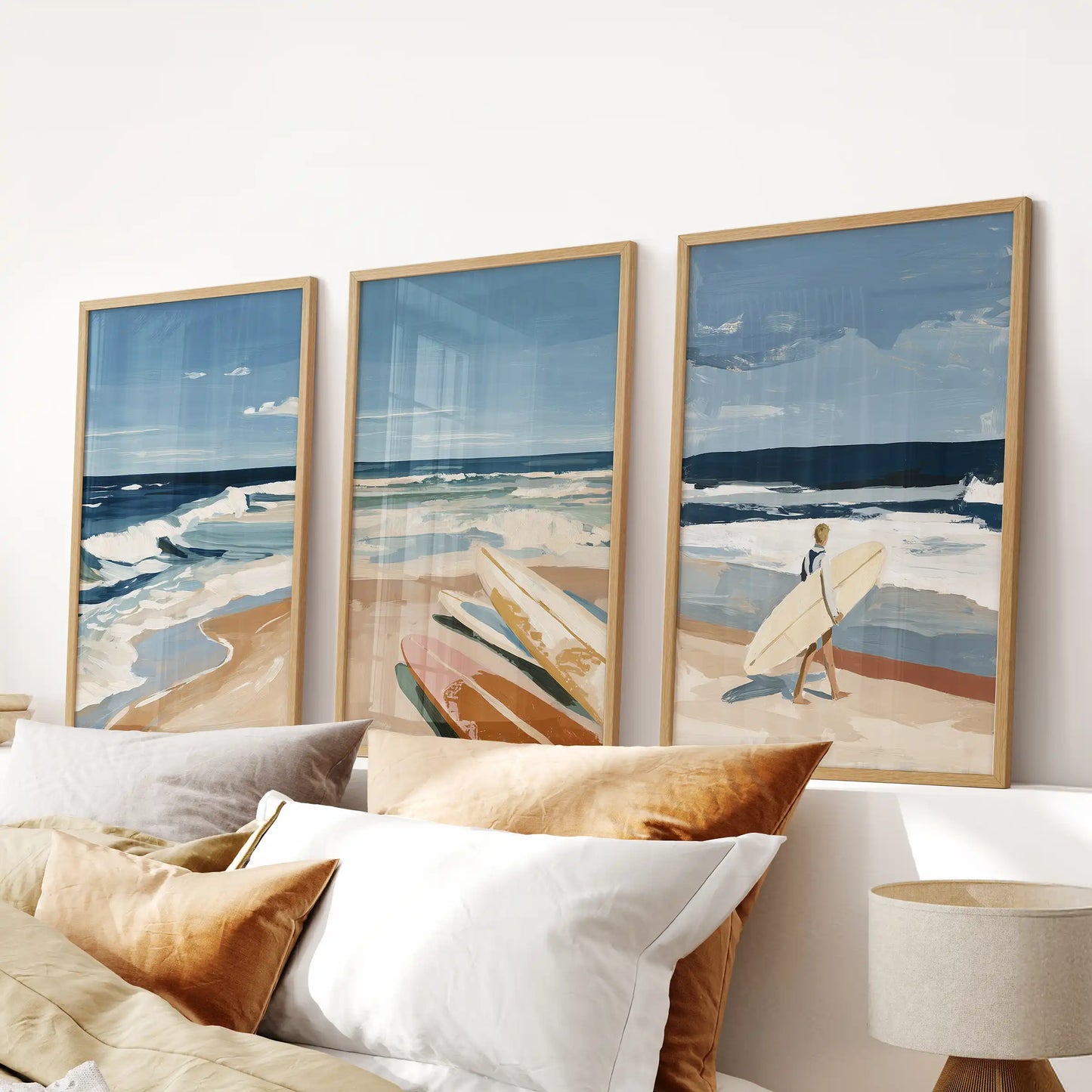 Thin wood frames hold a three-piece wave art set above the bed, the rolling pattern lending gentle rhythm to the bedroom.